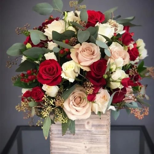 Mix Of Roses Arrangement In A Wooden Vase